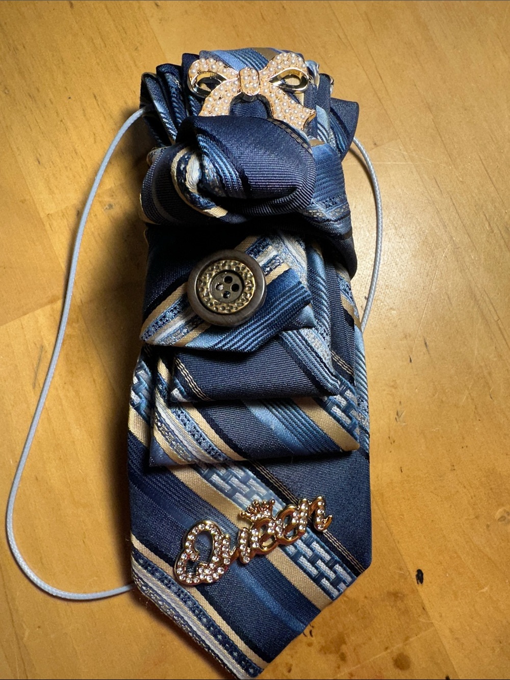 Wedgwood Blue and Gold Striped Necklace Tie with a Bow accent.